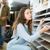 a person selecting karndean flooring from exhibition shelves